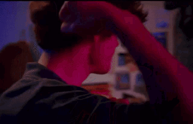 a blurry picture of a man and woman dancing in a room