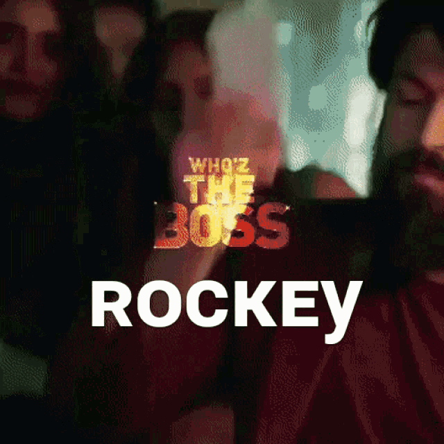 a poster for who 's the boss rockey with a man in the background