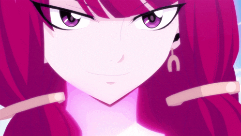 a close up of a girl 's face with purple hair and earrings with the letter c on them