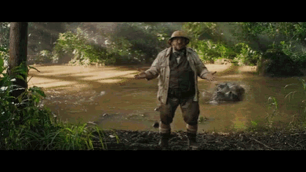 a man in a hat is standing in the middle of a river
