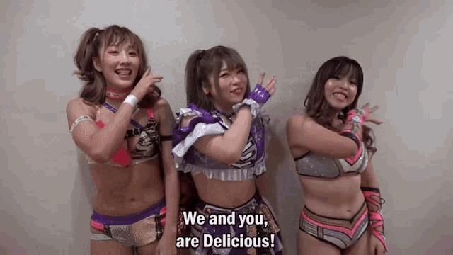 three female wrestlers are posing for a picture and one of them is saying we and you are delicious