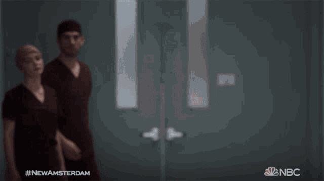 a group of people in scrubs are walking down a hallway with the hashtag #newamsterdam