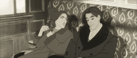 a man and a woman are sitting on a couch together .