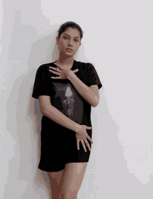 a woman in a black t-shirt with a picture of darth vader on it