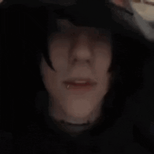a close up of a person wearing a hoodie that says vetements