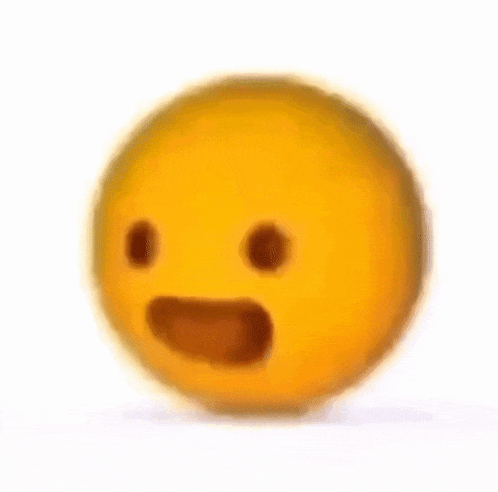 a blurry picture of a yellow smiley face with a surprised look on its face .