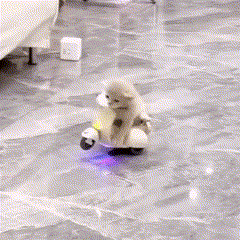 two penguins are riding a scooter on a tile floor