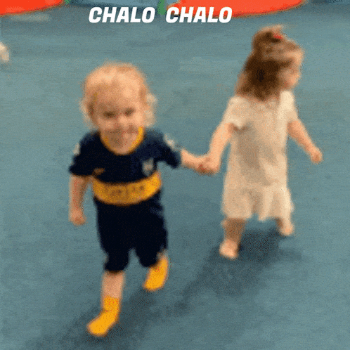 a boy and a girl are holding hands with the words chalo chalo behind them