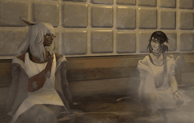 two women are sitting next to each other in a room