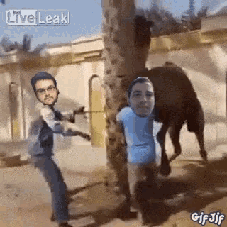 a man is standing next to a camel with a live leak watermark
