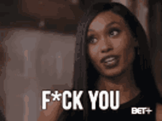 a woman is saying f * ck you in a gif .
