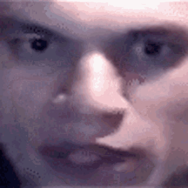 a close up of a person 's face with their eyes closed