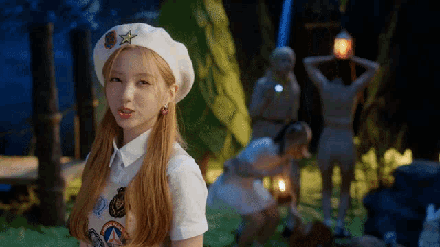 a girl wearing a beret with a star on it looks at the camera