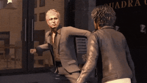 a man in a suit is kicking another man in the face