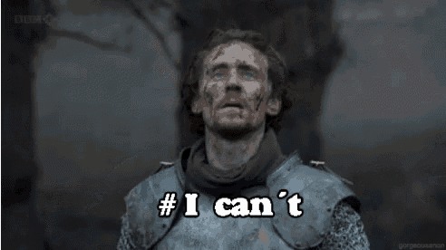 a man in armor is saying `` i can 't '' while holding a sword .