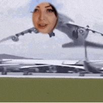 a woman 's head is visible above an airplane taking off from a runway