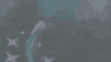 a blue dragon with a long tail is flying through the air in the dark .