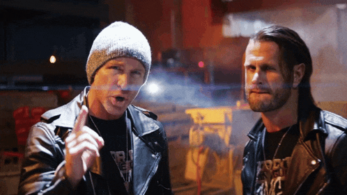 two men standing next to each other with one wearing a t-shirt that says ' portland fame '