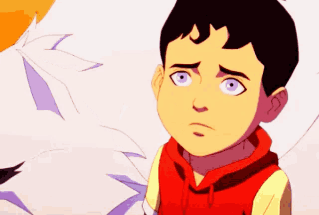 a young boy with blue eyes and a red hoodie is looking at something .