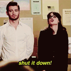 a man and a woman standing next to each other with the words shut it down written in yellow