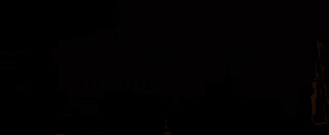 a man with a gun standing in the desert