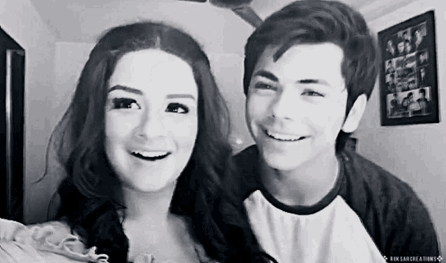 a black and white photo of a boy and a girl with the words kin sancreations on the bottom right