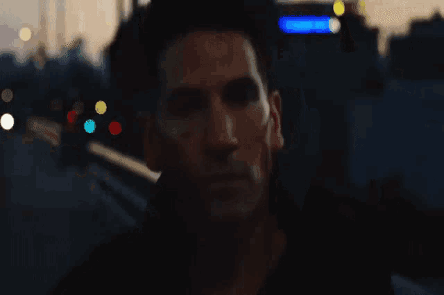 a man 's face is visible in a blurry photo