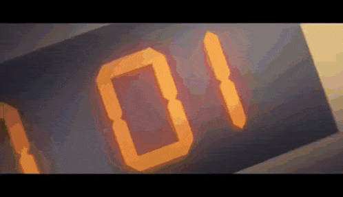 a digital clock displays the number 101 in orange letters