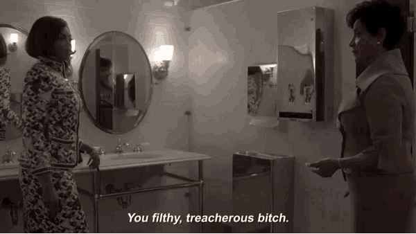 two women standing in a bathroom with the words you filthy treacherous bitch