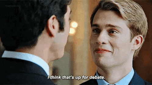 two men are looking at each other and one of them is saying i think that 's up for debate .