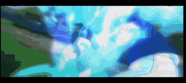 a blurry picture of a person with a blue light coming out of their face