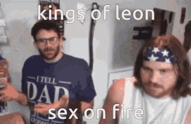 two men are standing next to each other and one of them is wearing a shirt that says i tell dad sex on fire