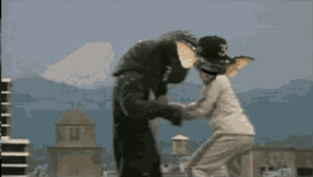 a gremlin wearing a hat with the number 3 on it attacks a man