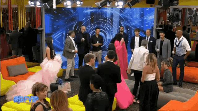 a group of people are gathered in front of a screen that says #gfvip on it