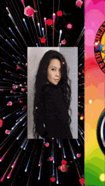 a woman with long black hair is surrounded by flowers and fireworks