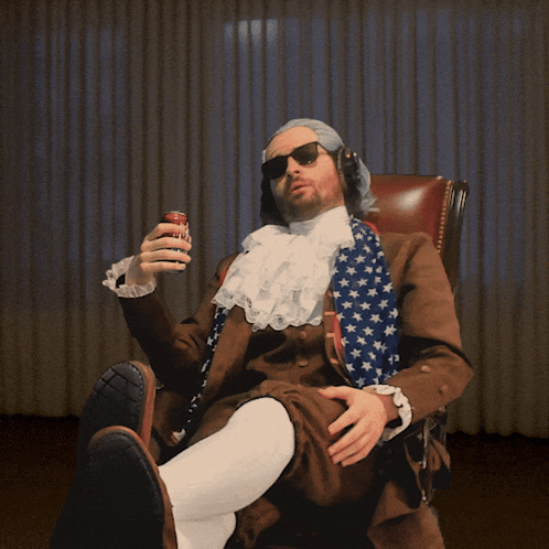 a man wearing a wig and sunglasses is sitting in a chair holding a can of coke