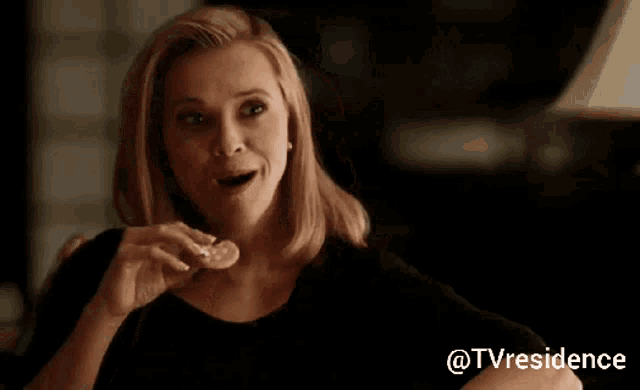 a woman sitting on a couch with the hashtag @tvresidence on the bottom