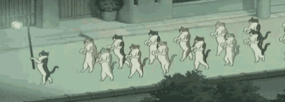 a group of cats are dancing on the sidewalk in a cartoon .