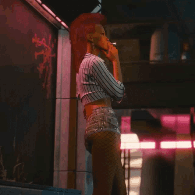 a woman with a mohawk smoking a cigarette in front of a chalkboard
