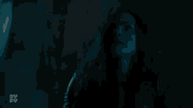 a woman in a dark room is asking the question " no "