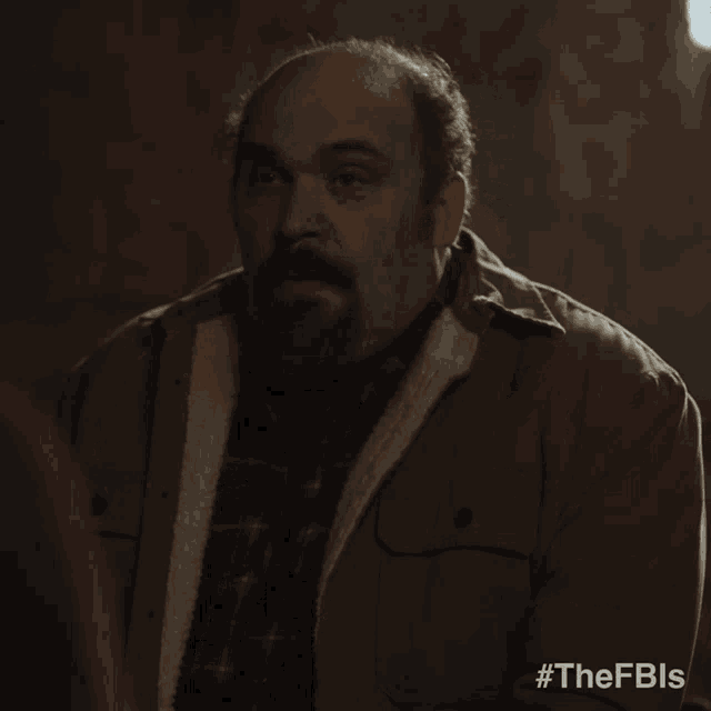 a man laying down with #thefbls on the bottom right