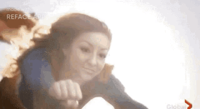 a woman is flying through the air with a superhero cape on .