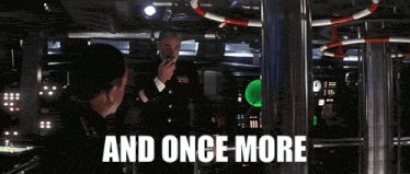 a man talking on a walkie talkie with the words and once more behind him