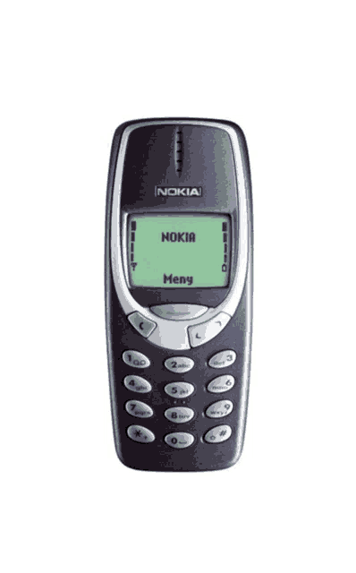 a nokia phone with a green screen that says menu