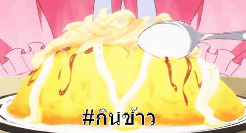 a hand is holding a spoon with food on it and the word # on the bottom left