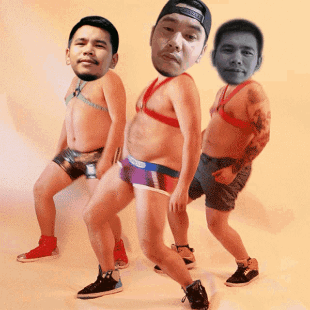 three men in underwear are posing for a picture with one wearing a hat that says ' nike ' on it