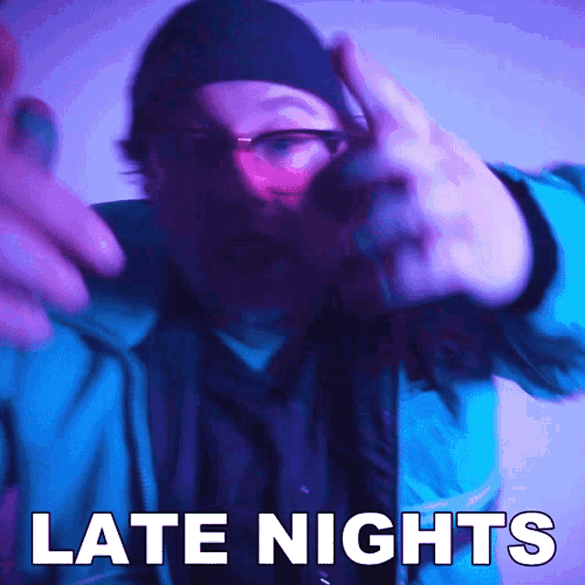 a man wearing glasses and a hat is pointing with the words late nights above him