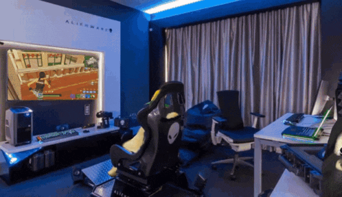 a room with an alienware logo on the wall behind a chair