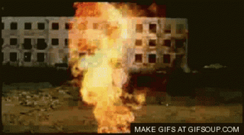 a picture of a building on fire with the words make gifs at gifsoup.com below it
