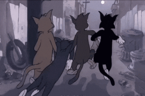three cartoon cats are running down a street .